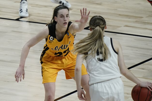 Iowa's Caitlin Clark defends UConn's Paige Bueckers during the second half of an NCAA college basketball game in the Sweet 16 round of the Women's NCAA tournament Saturday, March 27, 2021, at the Alamodome in San Antonio. (AP Photo/Morry Gash)