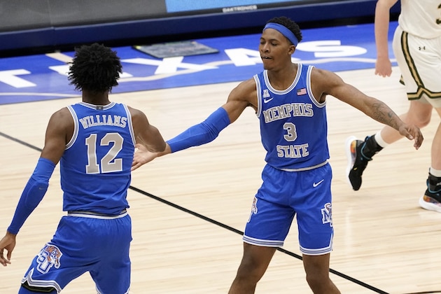 Memphis forward DeAndre Williams (12) and guard Landers Nolley II (3) celebrate a 3-point basket made by Nolley II in the second half of an NCAA college basketball game against Colorado State in the semifinals of the NIT, Saturday, March 27, 2021, in Frisco, Texas. (AP Photo/Tony Gutierrez)