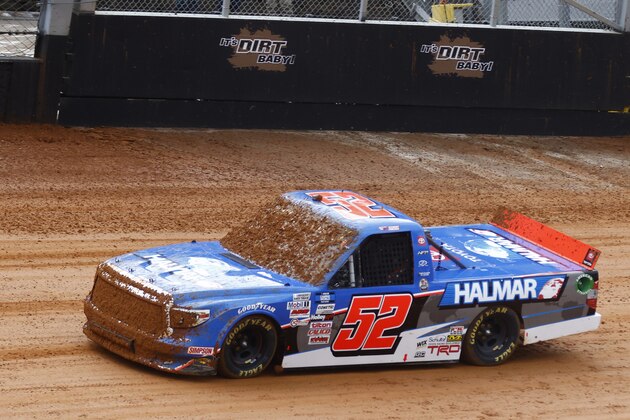 Mud covers the windshield and grill of driver Stewart Friesen truck during a heat race for a NASCAR Truck Series race on Saturday, March 27, 2021, in Bristol, Tenn. (AP Photo/Wade Payne)