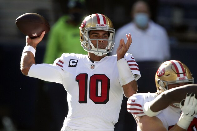 FILE - In this Sunday, Nov. 1, 2020, file photo, San Francisco 49ers quarterback Jimmy Garoppolo passes against the Seattle Seahawks during the first half of an NFL football game in Seattle. The San Francisco 49ers have made a big move to grab their quarterback of the future by trading up with Miami for the No. 3 pick in next month's draft. Drafting a quarterback would likely lead to the end of Jimmy Garoppolo's tenure in San Francisco either in a trade this season or after a year if the Niners opt to keep a veteran to help ease the transition for a rookie QB. (AP Photo/Scott Eklund, File)