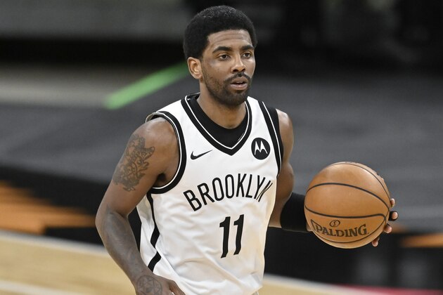 Brooklyn Nets' Kyrie Irving runs up the court during the second half of an NBA basketball game against the San Antonio Spurs, Monday, March 1, 2021, in San Antonio. Brooklyn won 124-113. (AP Photo/Darren Abate)