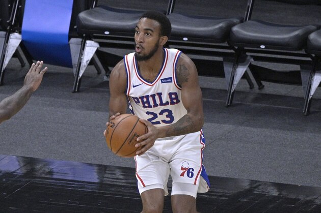 Philadelphia 76ers guard Terrance Ferguson (23) sets up for a shot in front of Orlando Magic forward Gary Clark (12) during the second half of an NBA basketball game, Thursday, Dec. 31, 2020, in Orlando, Fla. (AP Photo/Phelan M. Ebenhack)