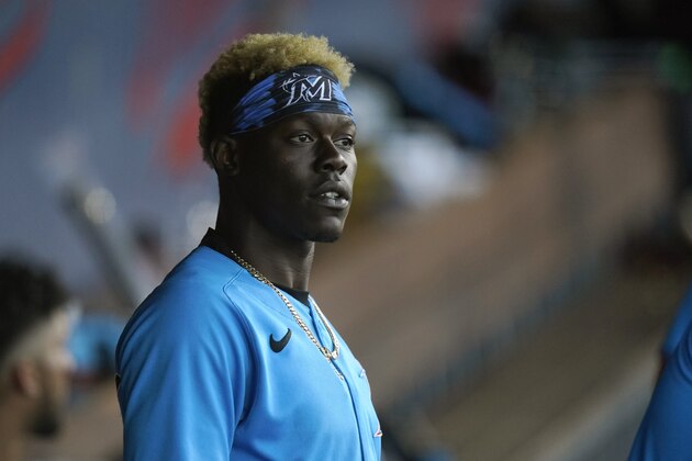 Miami Marlins second baseman Jazz Chisholm looks out from the dugout during a spring training baseball game against the Houston Astros, Friday, March 26, 2021, in West Palm Beach, Fla. (AP Photo/Lynne Sladky)