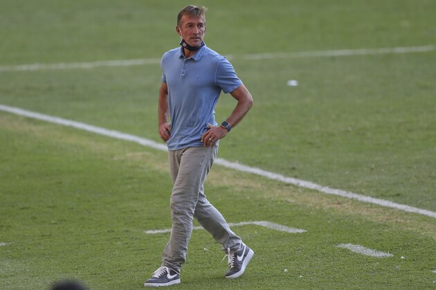 United States' coach Jason Kreis walks on the sideline during a Concacaf Men's Olympic qualifying championship semi-final soccer match against Honduras in Guadalajara, Mexico, Sunday, March 28, 2021. (AP Photo/Fernando Llano)