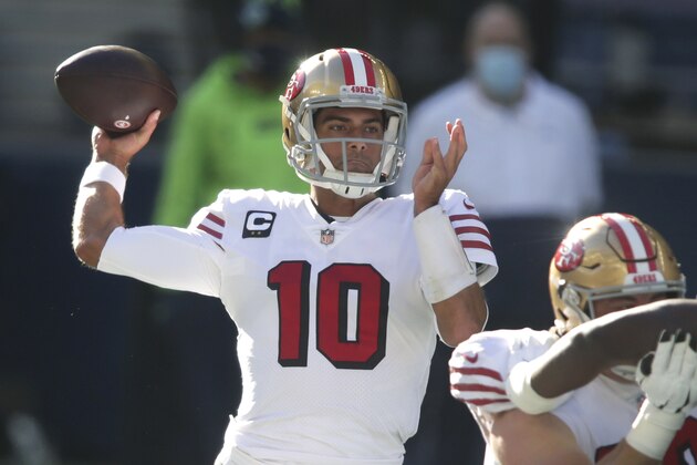 FILE - In this Sunday, Nov. 1, 2020 file photo, San Francisco 49ers quarterback Jimmy Garoppolo passes against the Seattle Seahawks during the first half of an NFL football game in Seattle. Jimmy Garoppolo isn't expected to take another snap this season for the San Francisco 49ers as a pair of high ankle sprains derailed most of his campaign.(AP Photo/Scott Eklund, File)