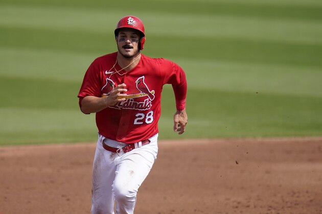 St. Louis Cardinals' Nolan Arenado runs to third on a throwing error by New York Mets catcher Tomas Nido during the first inning of a spring training baseball game Wednesday, March 3, 2021, in Jupiter, Fla. (AP Photo/Jeff Roberson)