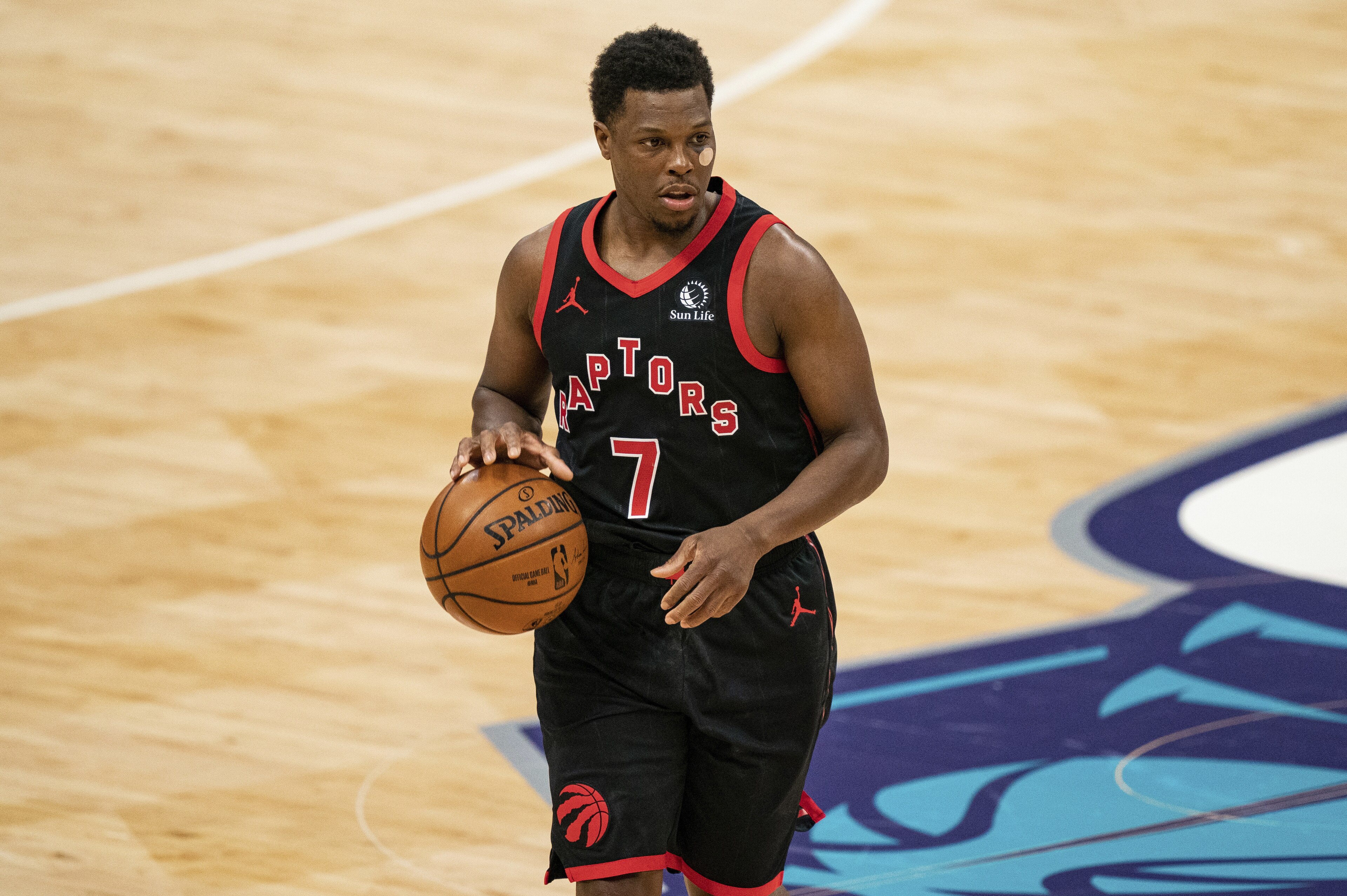 Toronto Raptors guard Kyle Lowry (7) brings the ball up court against the Charlotte Hornets during the second half of an NBA basketball game in Charlotte, N.C., Saturday, March 13, 2021. (AP Photo/Jacob Kupferman) Toronto Raptors guard Kyle Lowry (7) brings the ball up court against the Charlotte Hornets during the second half of an NBA basketball game in Charlotte, N.C., Saturday, March 13, 2021. (AP Photo/Jacob Kupferman)