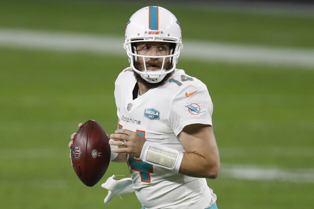 Miami Dolphins quarterback Ryan Fitzpatrick (14) looks to throw a pass against the Las Vegas Raiders during an NFL football game, Saturday, Dec. 26, 2020, in Las Vegas.The Dolphins won the game 26-25. (Jeff Haynes/AP Images for Panini)
