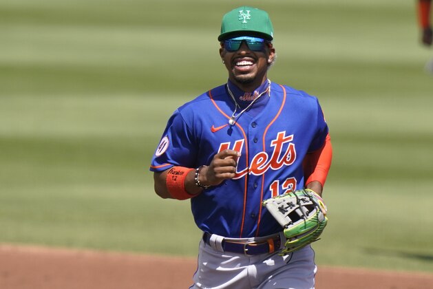 New York Mets shortstop Francisco Lindor runs to the dugout during a spring training baseball game against the Miami Marlins, Wednesday, March 17, 2021, in Jupiter, Fla. (AP Photo/Lynne Sladky)