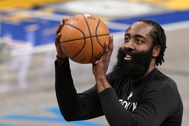 Brooklyn Nets guard James Harden (13) shoots during a team warmup before an NBA basketball game against the Washington Wizards, Sunday, March 21, 2021, in New York. (AP Photo/Kathy Willens)