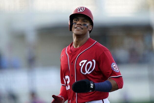 Washington Nationals' Juan Soto goes to the dugout after being thrown out at second during the second inning of a spring training baseball game against the Houston Astros, Wednesday, March 24, 2021, in West Palm Beach, Fl. (AP Photo/Lynne Sladky)