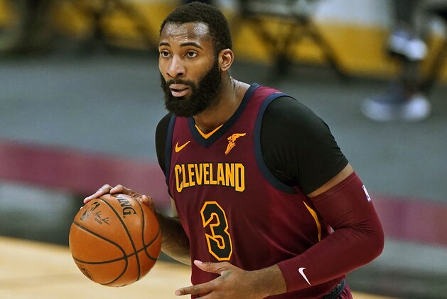FILE - In this Feb 5, 2021, file photo, Cleveland Cavaliers' Andre Drummond drives the second half of an NBA basketball game against the Milwaukee Bucks in Cleveland. Drummond is now a free agent and can sign with a contending team after reaching a buyout with the Cavaliers. Drummond, who has not played since mid-February, began negotiating terms of the buyout with the Cavs on Thursday, March 25, 2021, after the club could not trade the 27-year-old. (AP Photo/Tony Dejak, File)