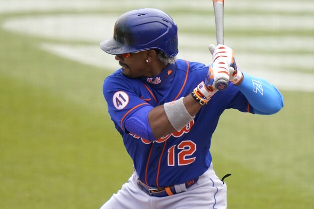 New York Mets' Francisco Lindor (12) bats during the first inning of a spring training baseball game against the Washington Nationals, Sunday, March 21, 2021, in West Palm Beach, Fla. (AP Photo/Lynne Sladky)