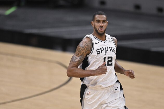San Antonio Spurs' LaMarcus Aldridge runs up the court during the second half of an NBA basketball game against the Memphis Grizzlies, Saturday, Jan. 30, 2021, in San Antonio. Memphis won 129-112. (AP Photo/Darren Abate)