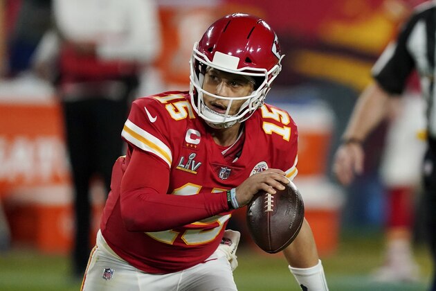 Kansas City Chiefs quarterback Patrick Mahomes (15) looks to make a pass during the second half of the NFL Super Bowl 55 football game against the Tampa Bay Buccaneers, Sunday, Feb. 7, 2021, in Tampa, Fla. The Tampa Bay Buccaneers defeated the Kansas City Chiefs 31-9. (AP Photo/Steve Luciano)