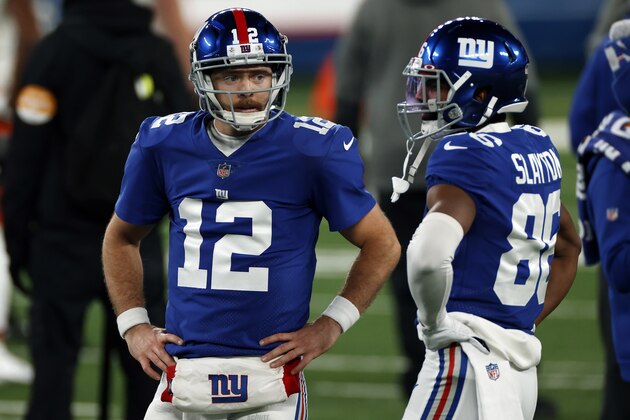 New York Giants quarterback Colt McCoy (12) talks with wide receiver Darius Slayton (86) before an NFL football game against the Cleveland Browns, Sunday, Dec. 20, 2020, in East Rutherford, N.J. (AP Photo/Adam Hunger)
