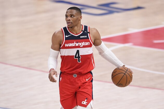 Washington Wizards guard Russell Westbrook (4) dribbles the ball during the first half of an NBA basketball game against the Detroit Pistons, Saturday, March 27, 2021, in Washington. (AP Photo/Nick Wass)