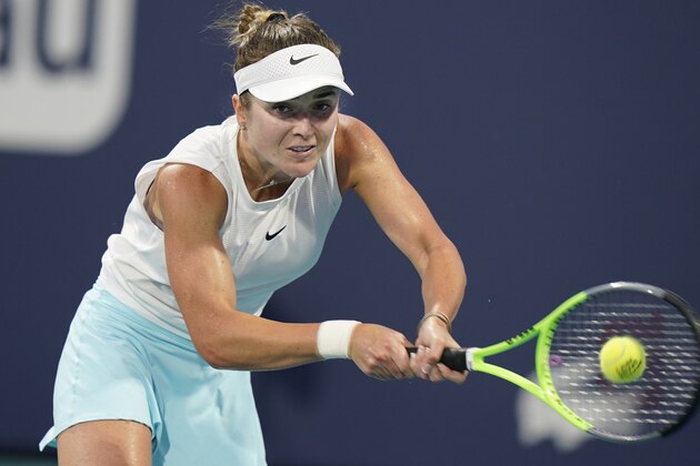 Elina Svitolina, of Ukraine, returns a shot from Anastasija Sevastova, of Latvia, during the Miami Open tennis tournament, Tuesday, March 30, 2021, in Miami Gardens, Fla. (AP Photo/Wilfredo Lee)