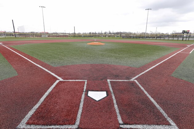 One of the 26 baseball diamonds sits unused at Grand Park in Westfield, Ind., Tuesday, April 7, 2020, with the facility closed due to the coronavirus outbreak. Westfield officials estimate the area could lose $85 million in direct spending if Grand Park stays closed through June. (AP Photo/Michael Conroy)