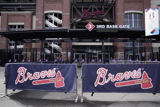 The stadium awaits fans to arrive at Truist Park, home of the Atlanta Braves, to attend the memorial for Baseball Hall of Famer and Braves legend Hank Aaron, Tuesday, Jan. 26, 2021, in Atlanta. Just 2 1/2 weeks before his death Friday, Han 22, 2021, at age 86, Aaron joined civil rights icons to receive the COVID-19 vaccine. He wanted to spread the word to the Black community that the shots were safe in the midst of a devastating pandemic. (AP Photo/Brynn Anderson) The stadium awaits fans to arrive at Truist Park, home of the Atlanta Braves, to attend the memorial for Baseball Hall of Famer and Braves legend Hank Aaron, Tuesday, Jan. 26, 2021, in Atlanta. Just 2 1/2 weeks before his death Friday, Han 22, 2021, at age 86, Aaron joined civil rights icons to receive the COVID-19 vaccine. He wanted to spread the word to the Black community that the shots were safe in the midst of a devastating pandemic. (AP Photo/Brynn Anderson)