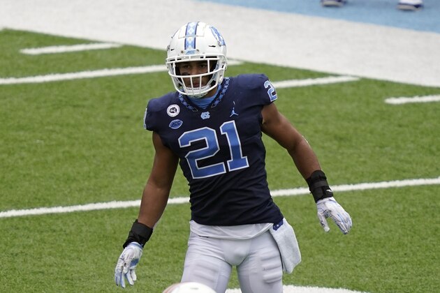 North Carolina linebacker Chazz Surratt (21) keeps an eye on the play during the second half of an NCAA college football game against Virginia Tech in Chapel Hill, N.C., Saturday, Oct. 10, 2020. (AP Photo/Gerry Broome)