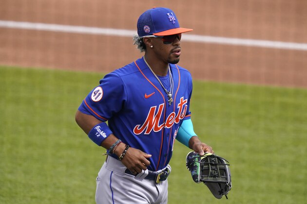 New York Mets' Francisco Lindor walks to the dugout before a spring training baseball game against the Washington Nationals, Monday, March 8, 2021, in West Palm Beach, Fla. (AP Photo/Lynne Sladky)