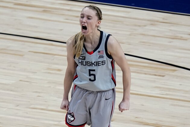 UConn guard Paige Bueckers (5) celebrates a score against Baylor during the second half of a college basketball game in the Elite Eight round of the women's NCAA tournament at the Alamodome in San Antonio, Monday, March 29, 2021. (AP Photo/Eric Gay)