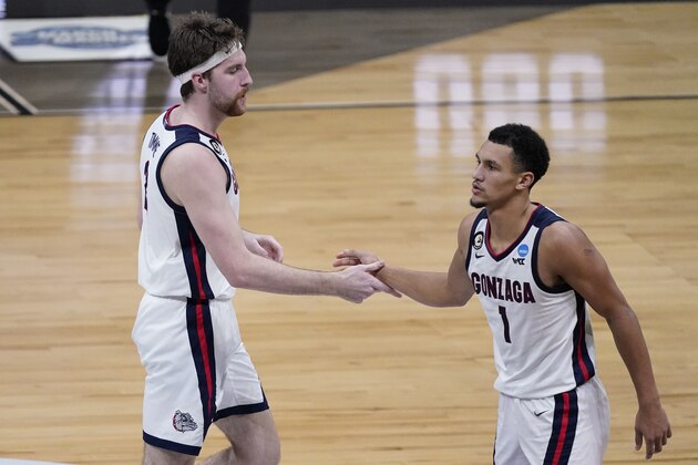 Gonzaga guard Jalen Suggs (1) celebrates with Gonzaga forward Drew Timme, left, during the second half of an Elite 8 game against Southern California in the NCAA men's college basketball tournament at Lucas Oil Stadium, Tuesday, March 30, 2021, in Indianapolis. (AP Photo/Darron Cummings)