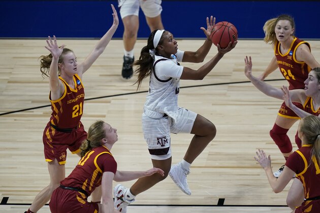 Texas A&M guard Aaliyah Wilson, center, drives to the basket past Iowa State guard Lexi Donarski (21) during the first half of a college basketball game in the second round of the women's NCAA tournament at the Alamodome in San Antonio, Wednesday, March 24, 2021. (AP Photo/Eric Gay)