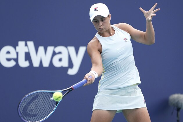 Ashleigh Barty, of Australia, returns to Aryna Sabalenka, of Belarus, during the Miami Open tennis tournament, Tuesday, March 30, 2021, in Miami Gardens, Fla. (AP Photo/Marta Lavandier)
