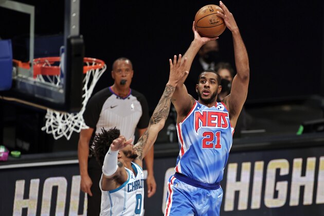 Brooklyn Nets center LaMarcus Aldridge shoots over Charlotte Hornets forward Miles Bridges during the first half of an NBA basketball game Thursday, April 1, 2021, in New York. (AP Photo/Adam Hunger)