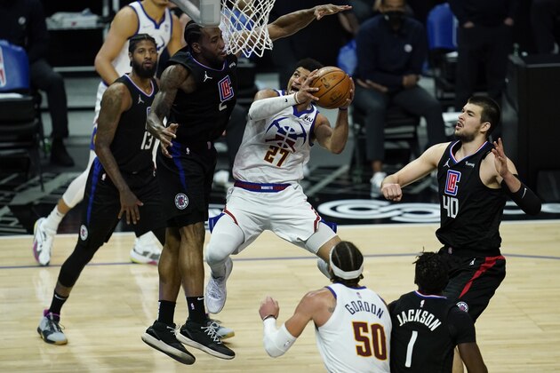 Denver Nuggets guard Jamal Murray (27) shoots against Los Angeles Clippers forward Kawhi Leonard (2) during the third quarter of an NBA basketball game Thursday, April 1, 2021, in Los Angeles. (AP Photo/Ashley Landis)