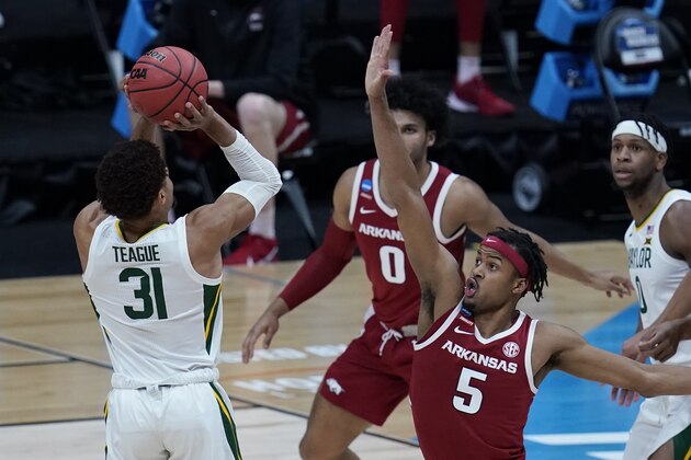 Baylor guard MaCio Teague (31) shoots on Arkansas guard Moses Moody (5) during the first half of an Elite 8 game in the NCAA men's college basketball tournament at Lucas Oil Stadium, Monday, March 29, 2021, in Indianapolis. (AP Photo/Michael Conroy)