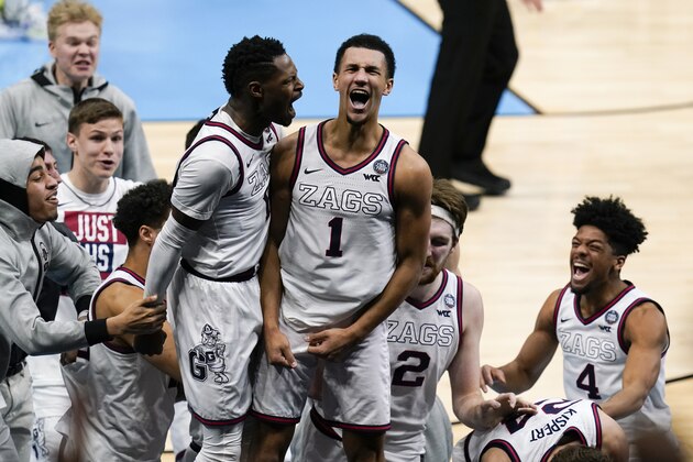 Gonzaga guard Jalen Suggs (1) celebrates making the game winning basket with Joel Ayayi, left, against UCLA during overtime in a men's Final Four NCAA college basketball tournament semifinal game, Saturday, April 3, 2021, at Lucas Oil Stadium in Indianapolis. Gonzaga won 93-90. (AP Photo/Michael Conroy)