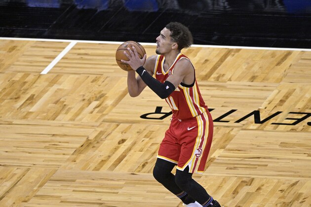 Atlanta Hawks guard Trae Young (11) sets up for a 3-point attempt during the second half of an NBA basketball game against the Orlando Magic, Wednesday, March 3, 2021, in Orlando, Fla. (AP Photo/Phelan M. Ebenhack)