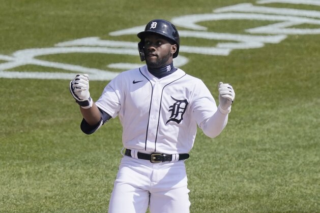 Detroit Tigers' Akil Baddoo reacts at home plate after his solo home run during the third inning of a baseball game against the Cleveland Indians, Sunday, April 4, 2021, in Detroit. (AP Photo/Carlos Osorio)
