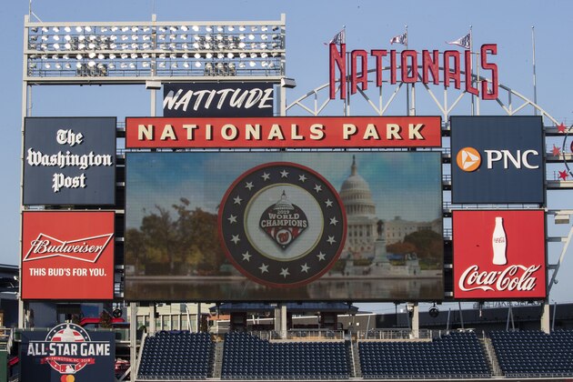 The scoreboard shows a World Champions logo for the Washington Nationals during an intrasquad baseball game at Nationals Park, Wednesday, July 15, 2020, in Washington. (AP Photo/Alex Brandon)