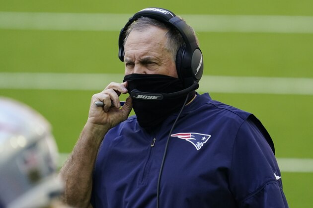New England Patriots head coach Bill Belichick wears a face mask on the sidelines during the first half of an NFL football game against the Houston Texans, Sunday, Nov. 22, 2020, in Houston. (AP Photo/David J. Phillip)