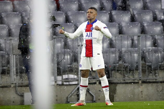 PSG's Kylian Mbappe celebrates after scoring the opening goal of his team during the Champions League quarterfinal soccer match between Bayern Munich and Paris Saint Germain in Munich, Germany, Wednesday, April 7, 2021. (AP Photo/Matthias Schrader)