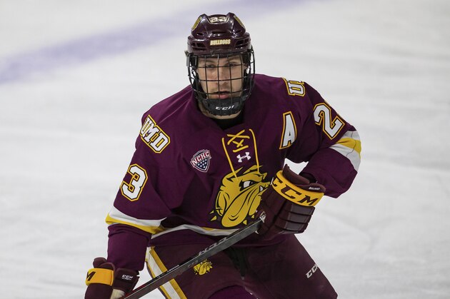 Minnesota-Duluth forward Nick Swaney (23) skating against the Nebraska-Omaha during an NCAA hockey game on Tuesday, Dec. 1, 2020, in Omaha, Neb. (AP Photo/John Peterson)