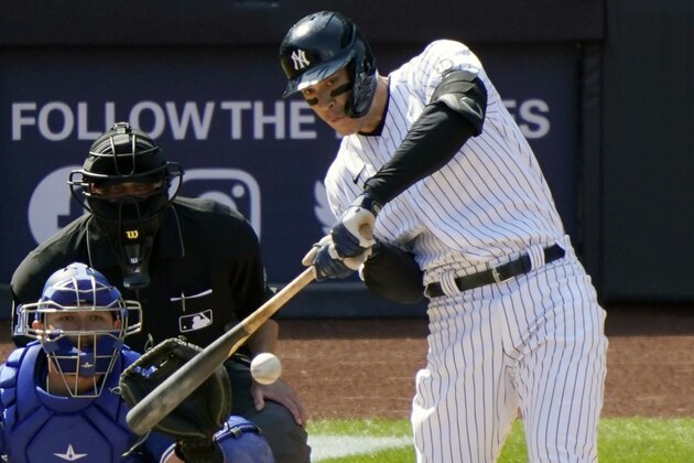 New York Yankees designated hitter Aaron Judge bats with Toronto Blue Jays catcher Alejandro Kirk (30) behind the plate in a baseball game, Sunday, April 4, 2021, at Yankee Stadium in New York. Home plate umpire Mark Carlson is behind the catcher.(AP Photo/Kathy Willens)