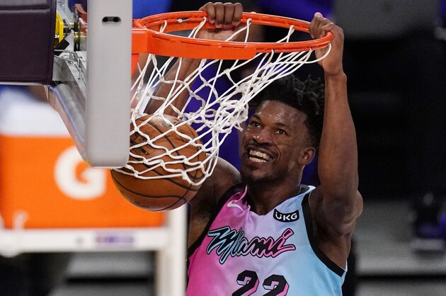 Miami Heat forward Jimmy Butler dunks during the second half of an NBA basketball game against the Los Angeles Lakers Saturday, Feb. 20, 2021, in Los Angeles. The Heat won 96-94. (AP Photo/Mark J. Terrill)