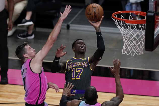 Los Angeles Lakers guard Dennis Schroder (17) drives to the basket as Miami Heat guard Goran Dragic (7) defends, during the first half of an NBA basketball game, Thursday, April 8, 2021, in Miami. (AP Photo/Marta Lavandier) Los Angeles Lakers guard Dennis Schroder (17) drives to the basket as Miami Heat guard Goran Dragic (7) defends, during the first half of an NBA basketball game, Thursday, April 8, 2021, in Miami. (AP Photo/Marta Lavandier)