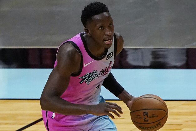 Miami Heat guard Victor Oladipo brings the ball up during the second half of the team's NBA basketball game against the Golden State Warriors, Thursday, April 1, 2021, in Miami. (AP Photo/Marta Lavandier)