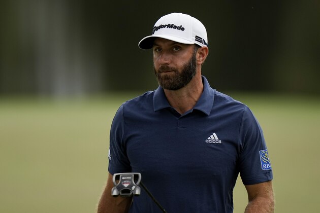 Dustin Johnson walks off the 16th green during the second round of the Masters golf tournament on Friday, April 9, 2021, in Augusta, Ga. (AP Photo/Matt Slocum)
