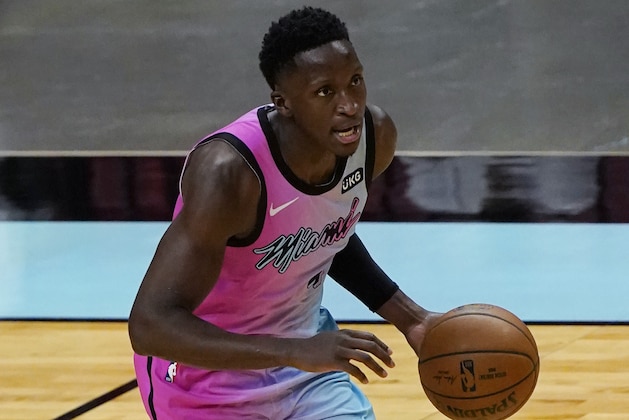 Miami Heat guard Victor Oladipo brings the ball up during the second half of the team's NBA basketball game against the Golden State Warriors, Thursday, April 1, 2021, in Miami. (AP Photo/Marta Lavandier)