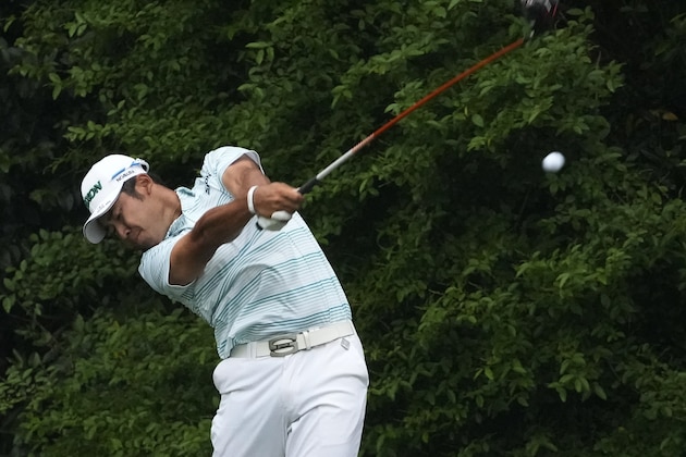 Hideki Matsuyama, of Japan, tees off on the 14th hole during the third round of the Masters golf tournament on Saturday, April 10, 2021, in Augusta, Ga. (AP Photo/Charlie Riedel)