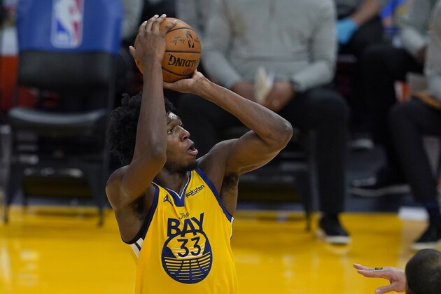 Golden State Warriors center James Wiseman (33) shoots against the Milwaukee Bucks during the first half of an NBA basketball game in San Francisco, Tuesday, April 6, 2021. (AP Photo/Jeff Chiu)