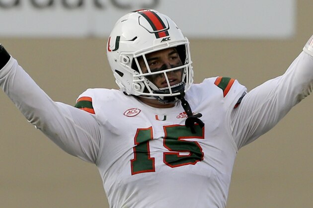 Jaelan Phillips of Miami celebrates a defensive stop during the second half of an NCAA college football game against Virginia Tech Saturday, Nov. 14, 2020, in Blacksburg, Va. (Matt Gentry/The Roanoke Times via AP, Pool)