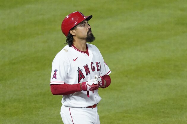 Los Angeles Angels third baseman Anthony Rendon (6) removes his gloves during a baseball game against the Chicago White Sox Saturday, April 3, 2021, in Anaheim, Calif. (AP Photo/Ashley Landis)